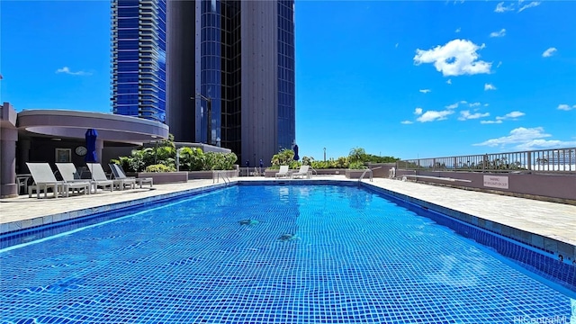 view of pool featuring a patio area