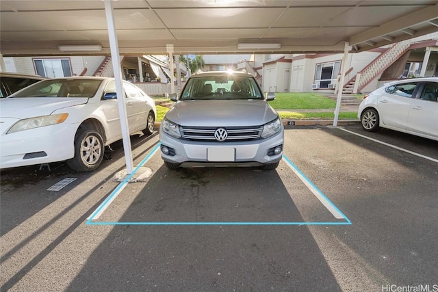 view of parking featuring a carport