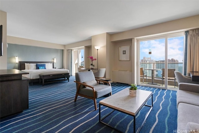 living area with a city view and dark carpet