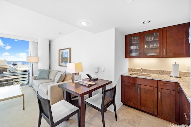 dining space featuring sink and floor to ceiling windows