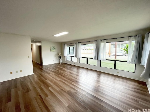 empty room with wood-type flooring