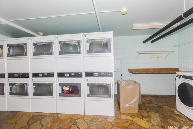 laundry area featuring washing machine and dryer and stacked washer and clothes dryer