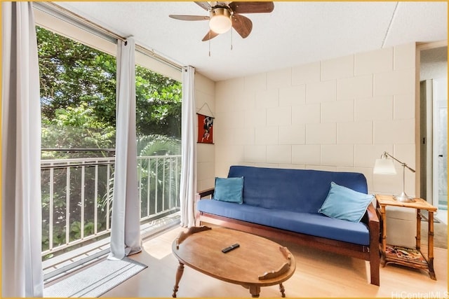 sitting room featuring ceiling fan