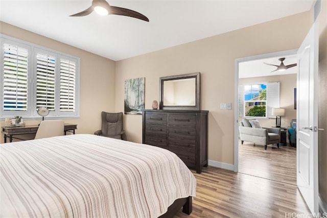 bedroom featuring ceiling fan and light wood-type flooring