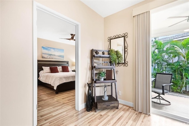 bedroom featuring access to outside and light hardwood / wood-style floors