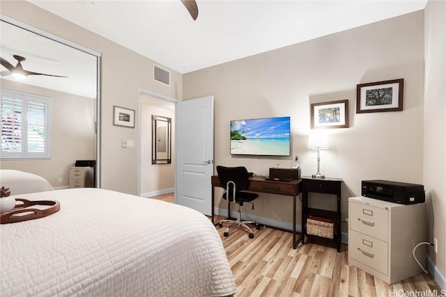 bedroom with ceiling fan and light wood-type flooring