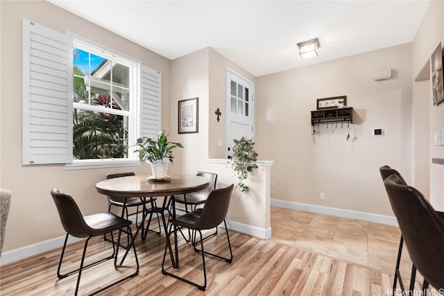 dining space featuring light hardwood / wood-style floors