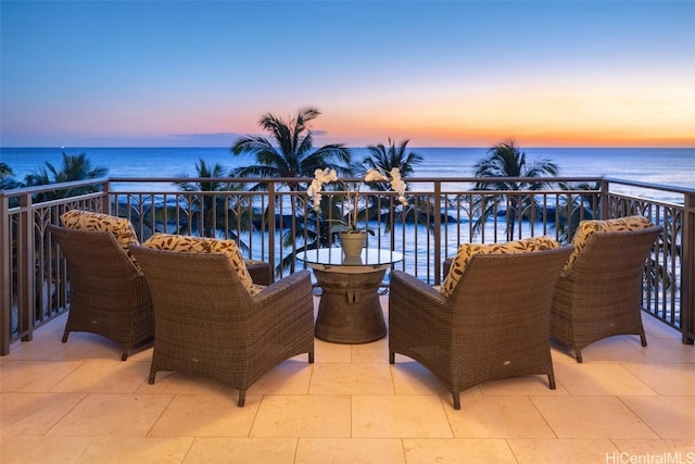 balcony at dusk with a water view