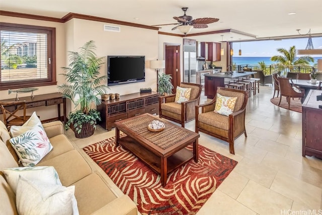 tiled living room featuring ceiling fan and crown molding