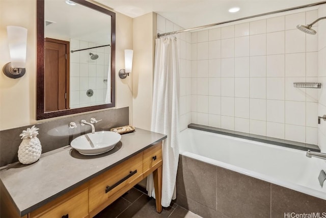 bathroom featuring shower / tub combo with curtain and vanity