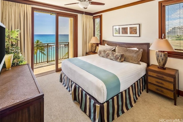 carpeted bedroom with ceiling fan, ornamental molding, access to exterior, and a water view