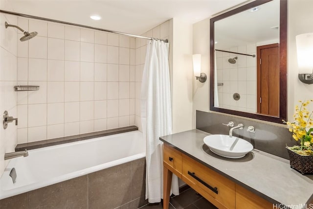 bathroom with shower / bath combo with shower curtain and vanity