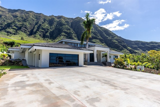 view of side of home featuring a mountain view