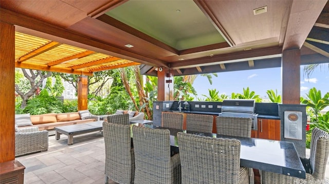 view of patio / terrace with a grill, exterior kitchen, and an outdoor living space