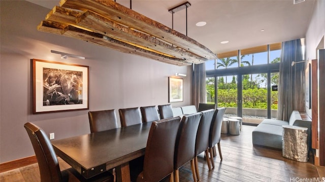 dining space with hardwood / wood-style flooring and floor to ceiling windows