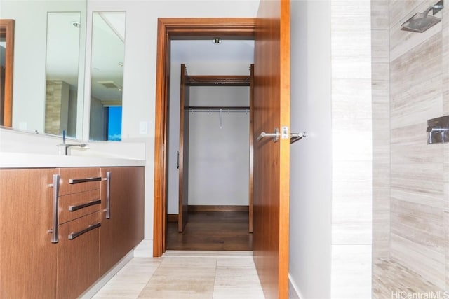 bathroom with tile patterned floors and vanity