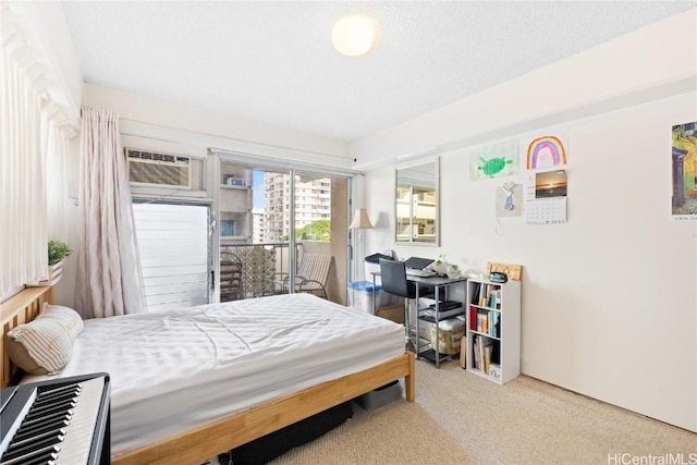 carpeted bedroom featuring a wall mounted air conditioner