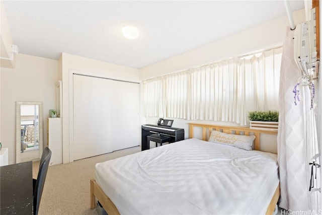 carpeted bedroom with a closet