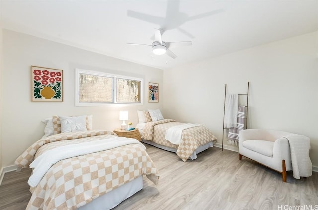 bedroom with ceiling fan and light wood-type flooring