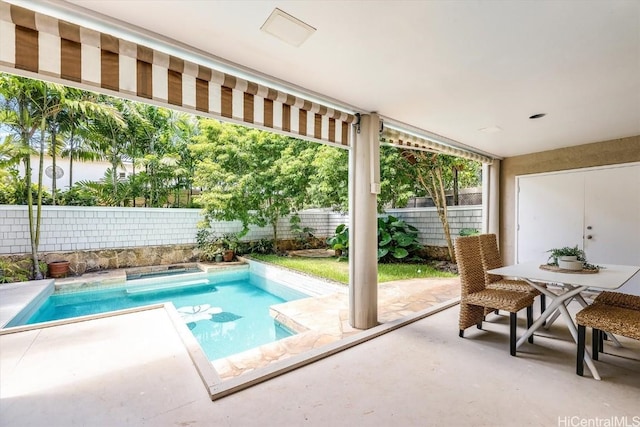 view of pool featuring a hot tub and a patio area