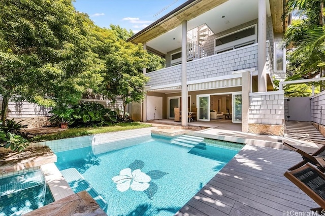 view of swimming pool with pool water feature