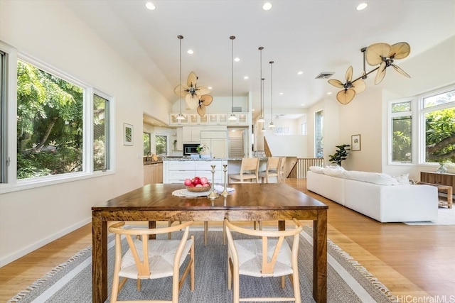 dining space with light hardwood / wood-style flooring