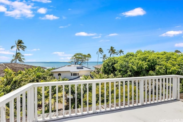 balcony featuring a water view