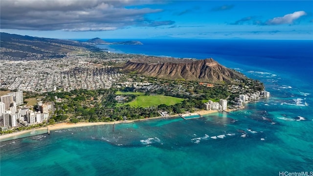 birds eye view of property with a water and mountain view