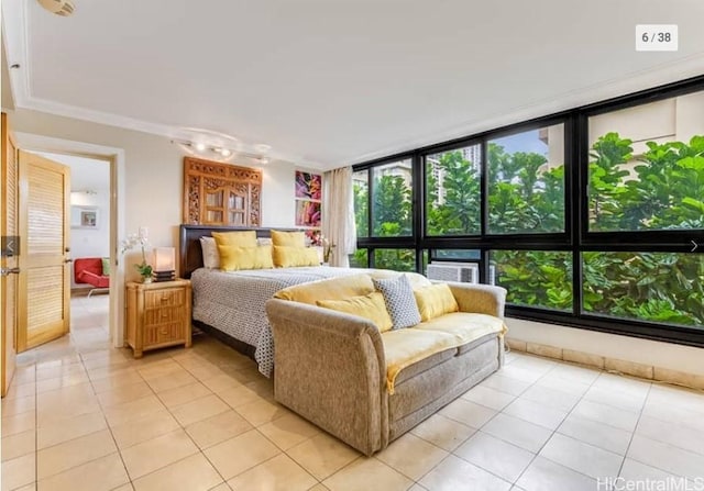 bedroom with crown molding, expansive windows, and light tile patterned floors