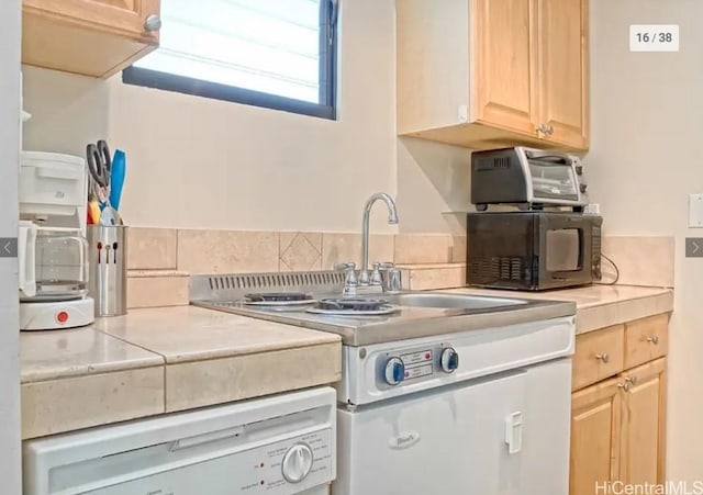 kitchen with light brown cabinets and dishwasher