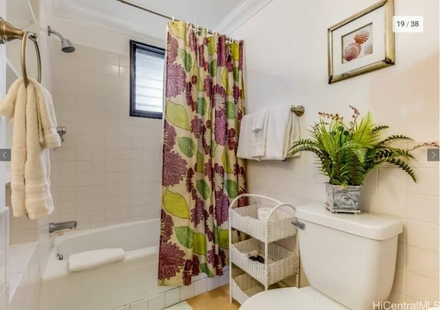 bathroom with ornamental molding, shower / bath combination with curtain, and toilet