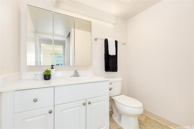 bathroom with toilet and vanity