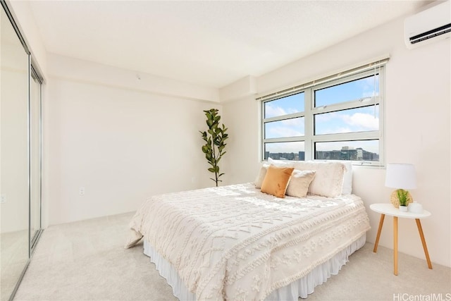 carpeted bedroom featuring a closet and a wall mounted air conditioner