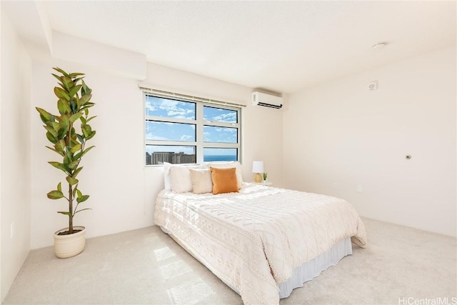 bedroom featuring light colored carpet and a wall unit AC