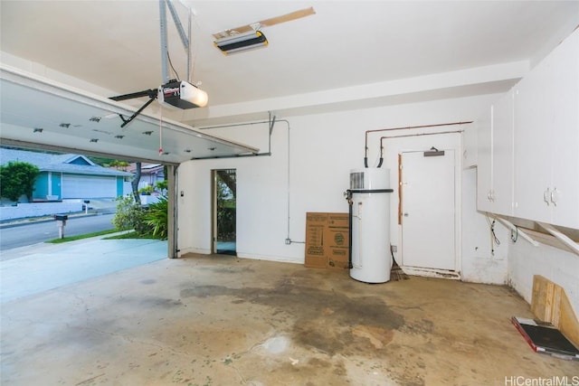 garage with water heater and a garage door opener