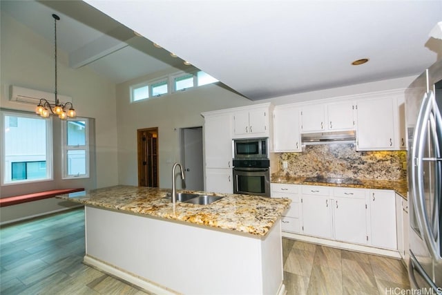 kitchen with sink, stainless steel appliances, white cabinets, and pendant lighting