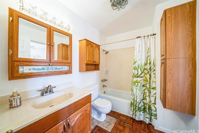 full bathroom with toilet, shower / tub combo with curtain, and vanity