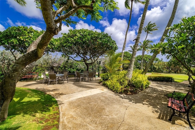 view of home's community with a patio area