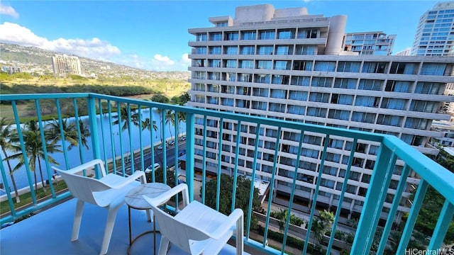 balcony featuring a mountain view