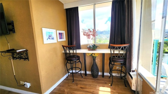 interior space featuring wood finished floors and baseboards