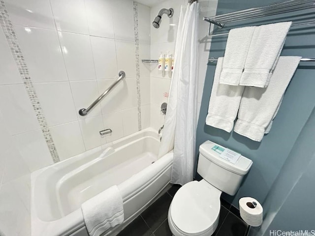 bathroom with tile patterned flooring, shower / bath combination with curtain, and toilet