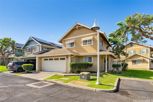 view of front facade with solar panels and a front lawn