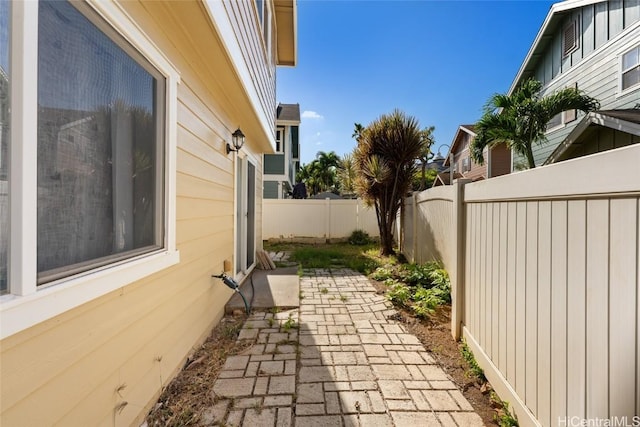 view of side of home with a patio area