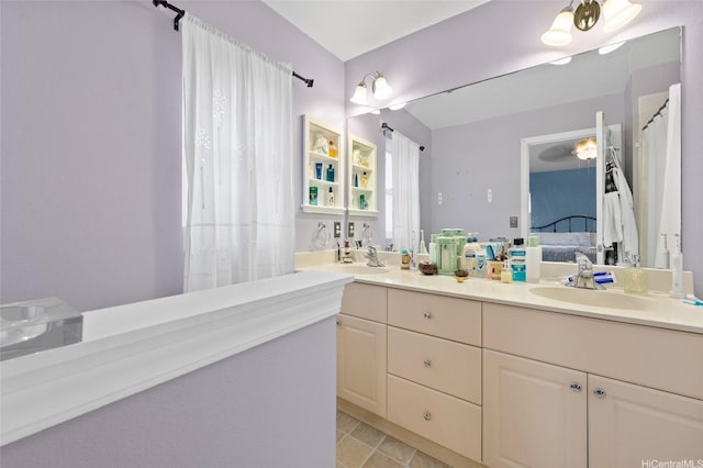 87-1980 Pakeke St Unit J, Waianae, HI 96792 - ensuite bathroom with double vanity and tile patterned floors