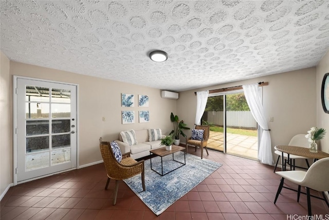 tiled living room featuring a textured ceiling and a wall mounted air conditioner