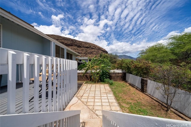 view of yard with a mountain view and a patio