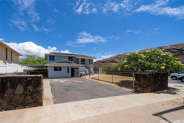 front of property featuring a mountain view