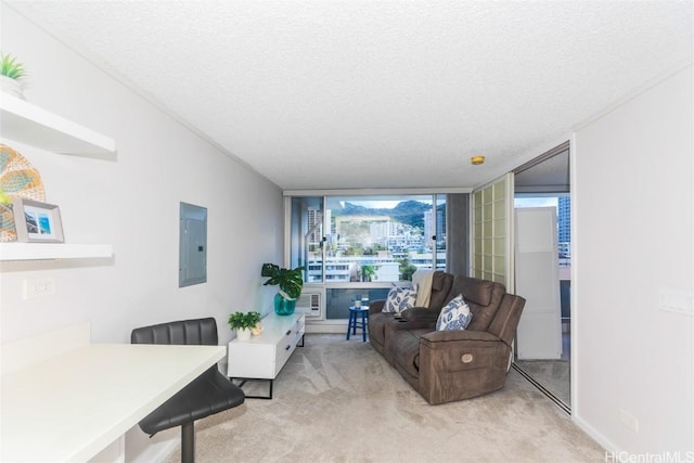 carpeted living room with floor to ceiling windows, a textured ceiling, and electric panel