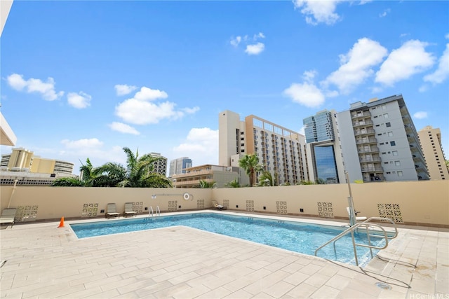 2240 Kuhio Ave Unit 1210, Honolulu, HI 96815 - community pool with a patio and a city view