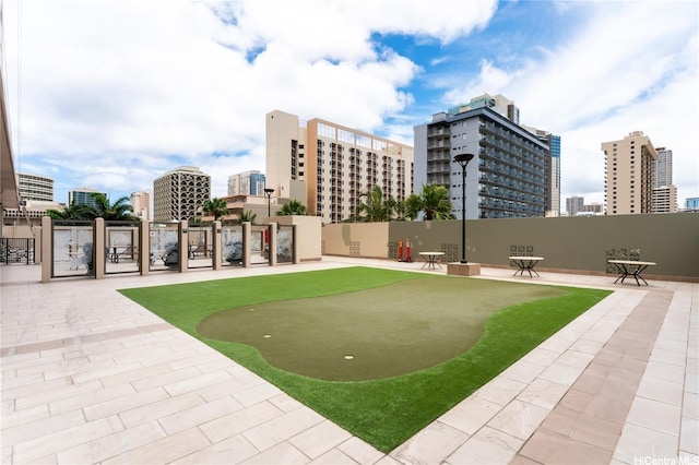 2240 Kuhio Ave Unit 1210, Honolulu, HI 96815 - surrounding community with a putting green and a view of city